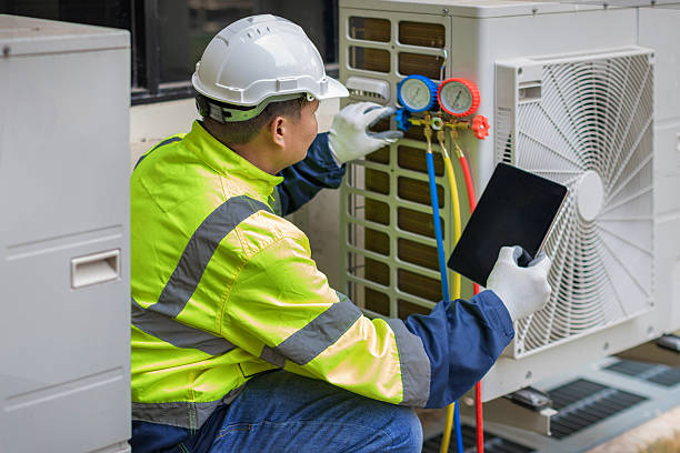 Professional Heat Pump Repair technician working in Morris Chapel, TN